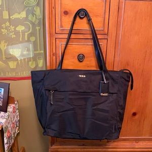 Tumi Black travel tote.  Good condition